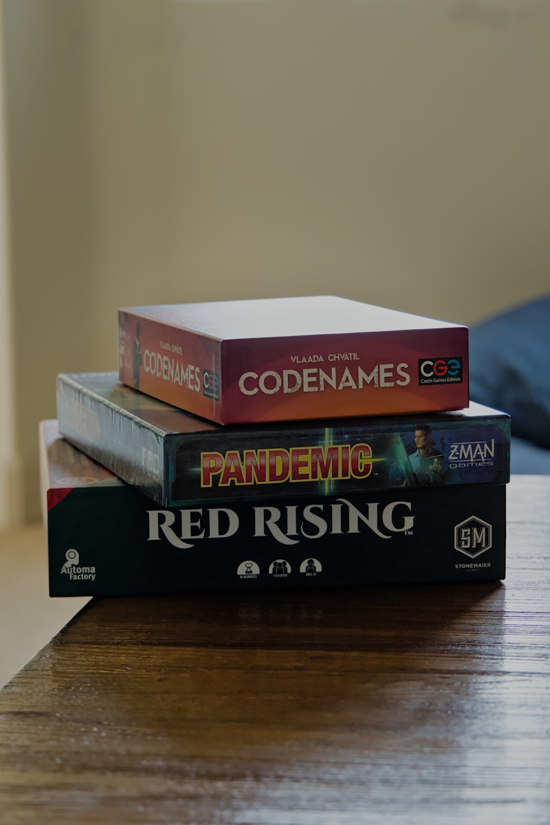 A stack of books sitting on top of a wooden table